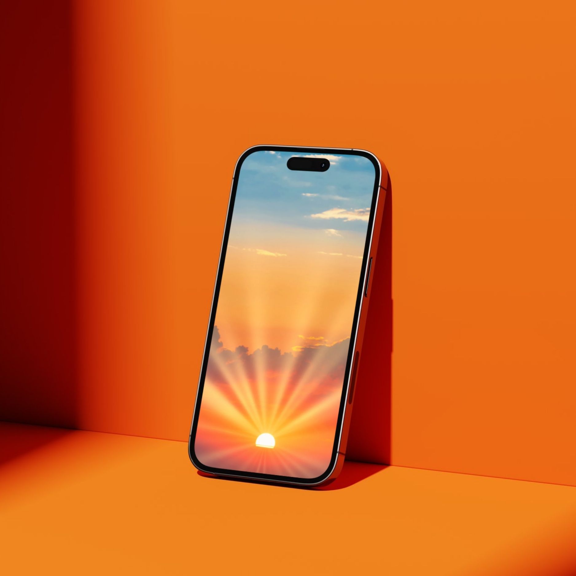 Phone screen with a picture of a vibrant orange sunrise